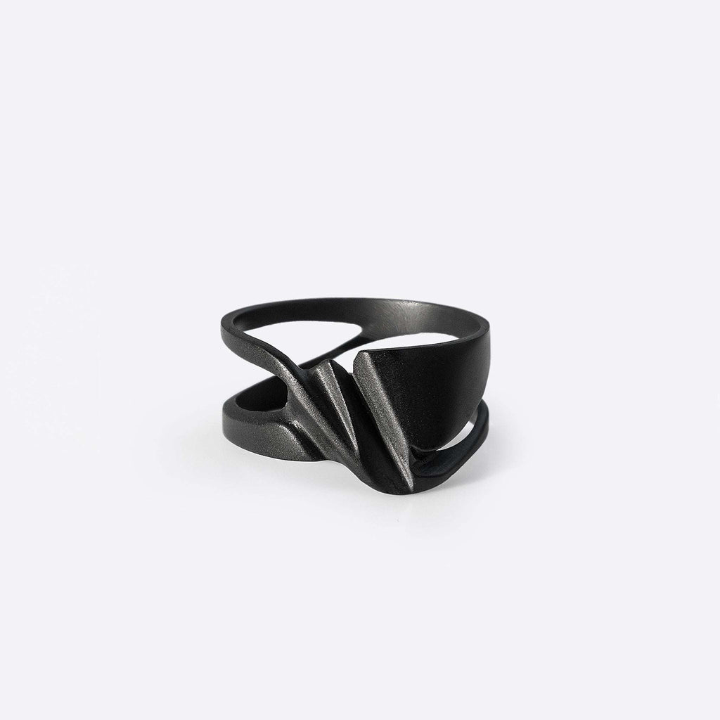 Velum Stainless Steel Ring with drapery-inspired curved design in black stainless steel