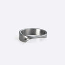 Amor stainless steel ring with clean line design and twisting band detail on white background