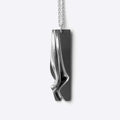 Nocturne Stainless Steel Pendant with twisting curves and precision edge detailing on a 22-inch chain