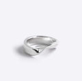Sterling silver Amos Ring with a minimal twisted band and polished finish against a white background