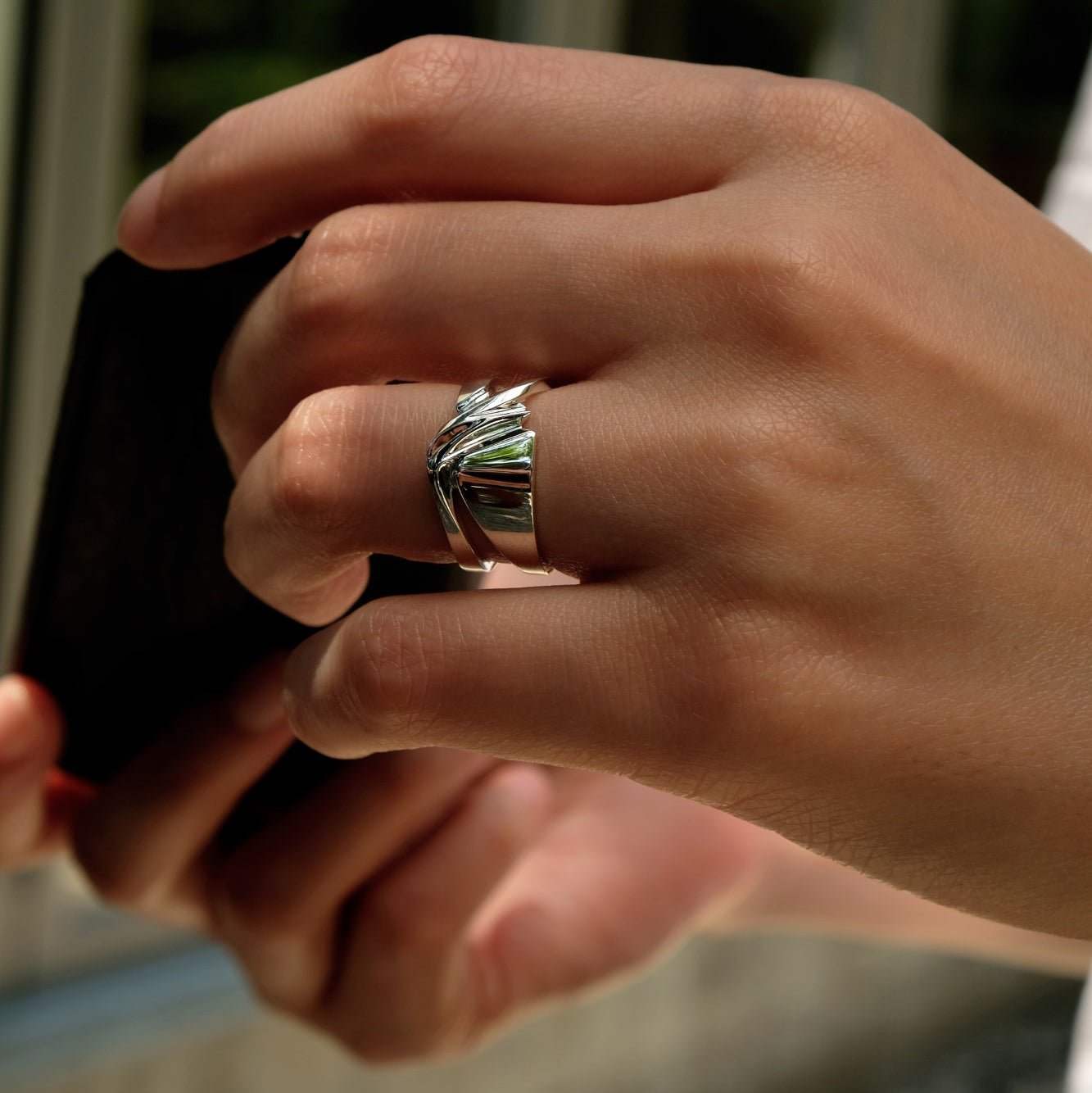 Velum Ring sterling silver with drapery inspired curvature on finger
