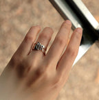 Velum Ring sterling silver drapery inspired open band worn on finger