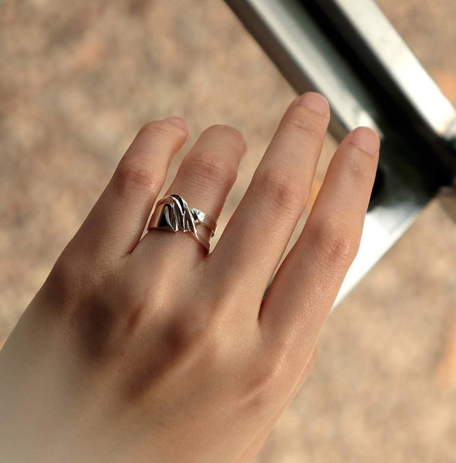 Velum Ring sterling silver drapery inspired open band worn on finger