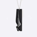 Nocturne Steel Pendant gray steel necklace with twisting stacking curves in modern design