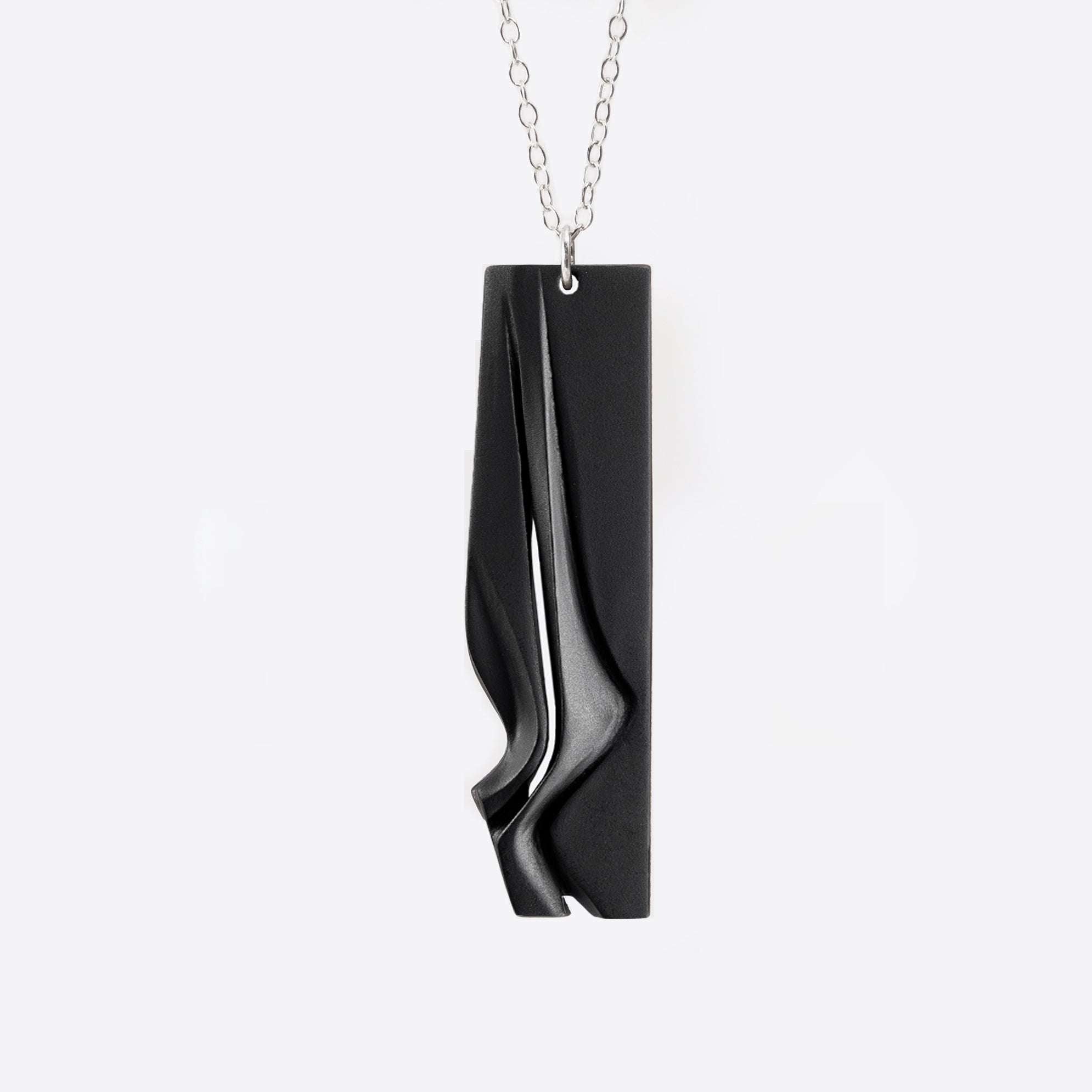 Nocturne Steel Pendant gray steel necklace with twisting stacking curves in modern design
